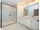 Elegant bathroom with double vanity and walk-in shower at 10505 Boudreaux St, Huntersville, NC 28078