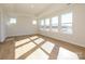 Bright bedroom with hardwood floors and large windows at 10505 Boudreaux St, Huntersville, NC 28078