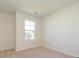 Simple bedroom with carpet and a window at 10505 Boudreaux St, Huntersville, NC 28078