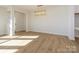 Bright dining room with hardwood floors and a modern chandelier at 10505 Boudreaux St, Huntersville, NC 28078