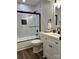 Updated bathroom with marble tile, a walk-in shower, and modern vanity at 11052 Cedar View Rd, Charlotte, NC 28226