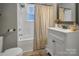 Bathroom with white vanity, tub, and shower at 200 Cleveland Ave, Shelby, NC 28150