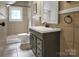 Bathroom with gray vanity, shower, and tile flooring at 200 Cleveland Ave, Shelby, NC 28150