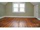 Bedroom with hardwood floors and two windows at 200 Cleveland Ave, Shelby, NC 28150