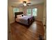 Spacious bedroom with hardwood floors and ceiling fan at 200 Cleveland Ave, Shelby, NC 28150