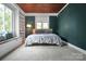 Bedroom with built-in window seat and wood paneled ceiling at 200 Cleveland Ave, Shelby, NC 28150