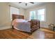 Well-lit bedroom featuring hardwood floors and a ceiling fan at 200 Cleveland Ave, Shelby, NC 28150