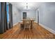 Bright dining room features hardwood floors and a charming farmhouse table at 200 Cleveland Ave, Shelby, NC 28150