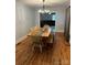 Bright dining room with hardwood floors and a rustic wooden table at 200 Cleveland Ave, Shelby, NC 28150