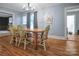 Farmhouse style dining room with hardwood floors and a large wooden table at 200 Cleveland Ave, Shelby, NC 28150