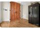 Bright kitchen with wood flooring and barn-style pantry doors at 200 Cleveland Ave, Shelby, NC 28150