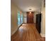 Kitchen with wood flooring, barn doors, and French doors to backyard at 200 Cleveland Ave, Shelby, NC 28150