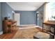 Living room with hardwood floors, neutral walls, and a large area rug at 200 Cleveland Ave, Shelby, NC 28150