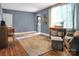 Living room with hardwood floors, neutral walls, and a large area rug at 200 Cleveland Ave, Shelby, NC 28150