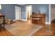 Living room with hardwood floors, neutral walls, and comfortable seating area at 200 Cleveland Ave, Shelby, NC 28150