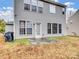 Rear exterior view of the home showing large windows and backyard access at 2715 Ballade Dr, Matthews, NC 28105