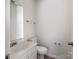 A small bathroom with a white toilet and sink at 2715 Ballade Dr, Matthews, NC 28105