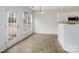 Bright dining area with tile flooring and backyard access at 2715 Ballade Dr, Matthews, NC 28105