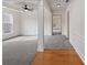 Spacious living room featuring gray carpet and decorative white columns at 2715 Ballade Dr, Matthews, NC 28105