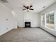 Bright living room featuring a fireplace and large windows at 2715 Ballade Dr, Matthews, NC 28105