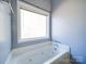 Bathroom with soaking tub and window at 615 Real Quiet Ct, York, SC 29745