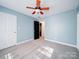 Bedroom with ceiling fan and neutral decor at 615 Real Quiet Ct, York, SC 29745