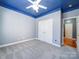 Bedroom with blue ceiling, double doors, and hardwood floors at 615 Real Quiet Ct, York, SC 29745