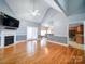 Spacious living room with hardwood floors, fireplace, and vaulted ceiling at 615 Real Quiet Ct, York, SC 29745