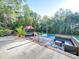 Deck with pool, patio furniture, and wooded view at 615 Real Quiet Ct, York, SC 29745