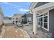 Comfortable outdoor space with string lights, a well-maintained patio, and cozy seating arrangements at 16115 Lakeside Loop Ln, Cornelius, NC 28031