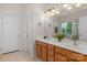 Double vanity bathroom with a large mirror and tile flooring at 2024 Holly Villa Cir, Indian Trail, NC 28079