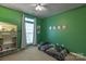 Green-walled bedroom with a twin-size bed and bookcase at 2024 Holly Villa Cir, Indian Trail, NC 28079