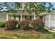 House exterior showcasing a covered front porch and neatly landscaped front yard at 2024 Holly Villa Cir, Indian Trail, NC 28079