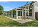 Backyard view of house with large sunroom addition at 2024 Holly Villa Cir, Indian Trail, NC 28079