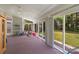 Sunroom with exercise bike and sliding glass doors at 2024 Holly Villa Cir, Indian Trail, NC 28079