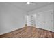 Bright bedroom featuring hardwood floors and double doors at 207 Davidson Gateway Dr, Davidson, NC 28036