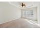 Large bedroom with neutral carpeting and ceiling fan at 3015 Duclair Ln, Fort Mill, SC 29707