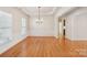 Spacious dining room featuring hardwood floors and chandelier at 3015 Duclair Ln, Fort Mill, SC 29707