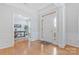 Bright foyer with hardwood floors and large front door with sidelights, leading to a study at 3015 Duclair Ln, Fort Mill, SC 29707