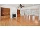 Spacious living area with hardwood floors and built-in shelving at 3015 Duclair Ln, Fort Mill, SC 29707