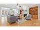 Cozy living room featuring a fireplace, built-in shelving, and comfortable seating at 3015 Duclair Ln, Fort Mill, SC 29707