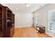 Home office featuring hardwood floors and built-in shelving at 3015 Duclair Ln, Fort Mill, SC 29707