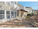 Brick patio with adjacent deck and wooded backyard views at 3015 Duclair Ln, Fort Mill, SC 29707