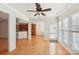 Bright sunroom with hardwood floors and ceiling fan at 3015 Duclair Ln, Fort Mill, SC 29707