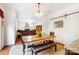 Open dining area with barn door and view into the living room with fireplace at 138 Huntly Ln, Mooresville, NC 28115