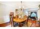 Bright dining room boasting hardwood floors, a chandelier, and seamless access to the living area at 138 Huntly Ln, Mooresville, NC 28115