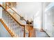 Bright entryway showcasing hardwood floors, carpeted stairs with white rails, and adjacent office space at 138 Huntly Ln, Mooresville, NC 28115