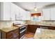 A close up view of the cabinets and stainless steel appliances in this renovated kitchen at 138 Huntly Ln, Mooresville, NC 28115