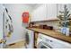 Laundry room features a butcher block counter, a washer and dryer, and ample storage space at 138 Huntly Ln, Mooresville, NC 28115