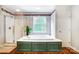 Bright main bathroom with a garden tub and a separate walk-in shower at 138 Huntly Ln, Mooresville, NC 28115